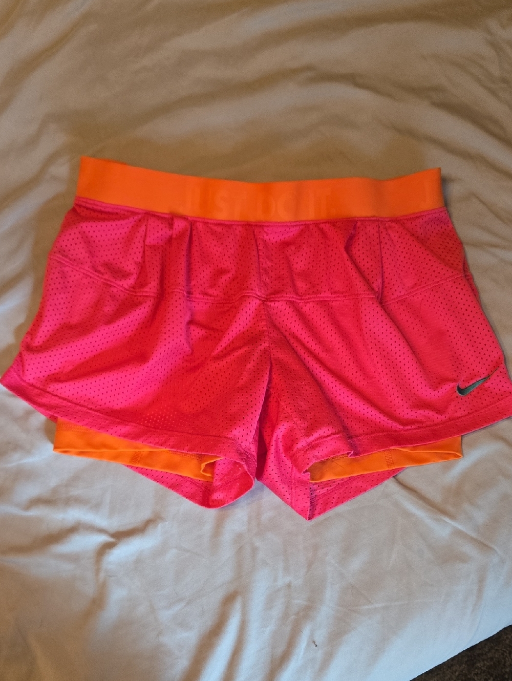 Nike Women’s Pink Athletic Shorts with Orange Waistband